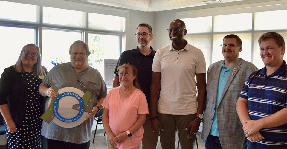 Ishpeming City officials stand with RRC award